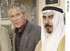 President Bush, shakes hands with Abdul-Sattar Abu Risha, right, leader of the Anbar Salvation Council